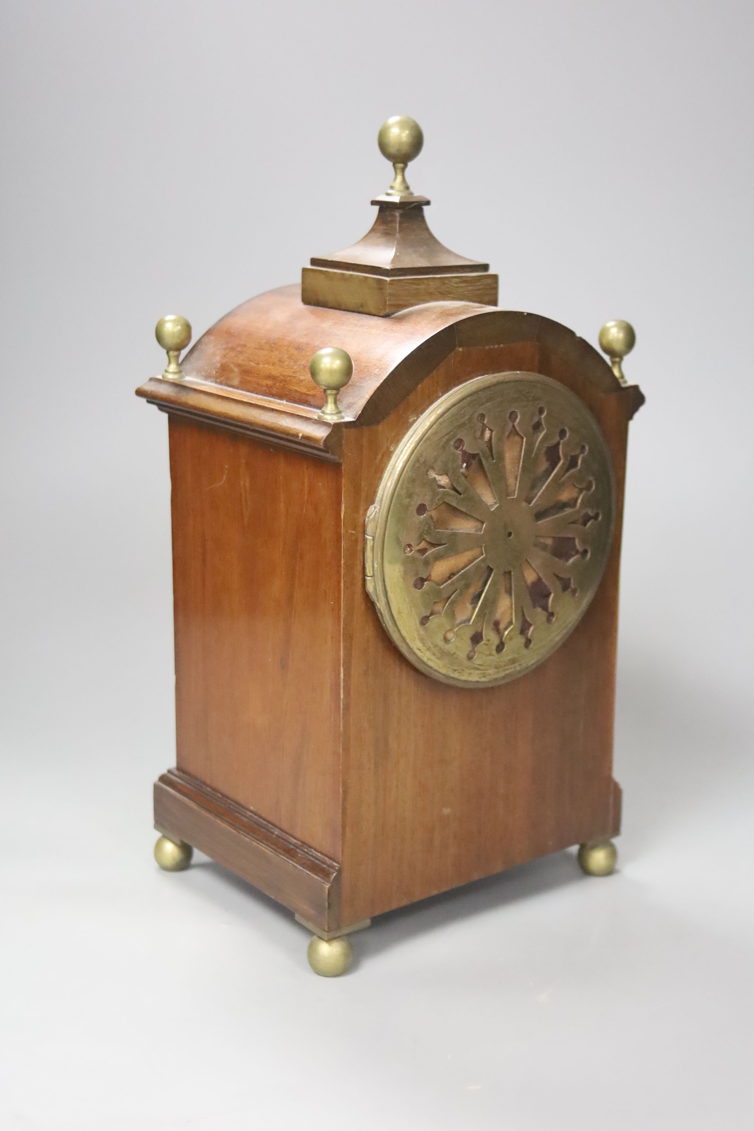 An inlaid mahogany mahogany mantel clock with brass ball finials, height 28cm